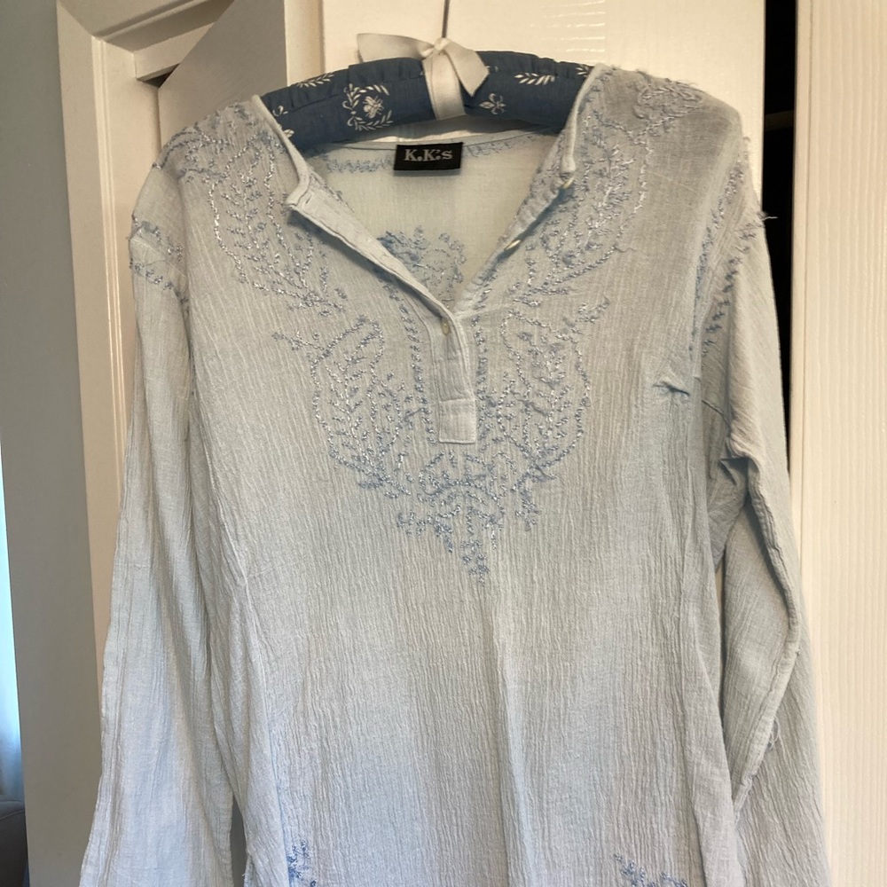 100 percent cotton, baby blue hippie shirt made in India.